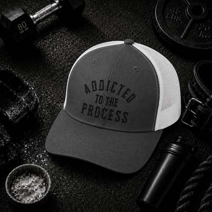 Addicted to the Process Blackout — Trucker Hat - Discipline Over Motivation 24/7