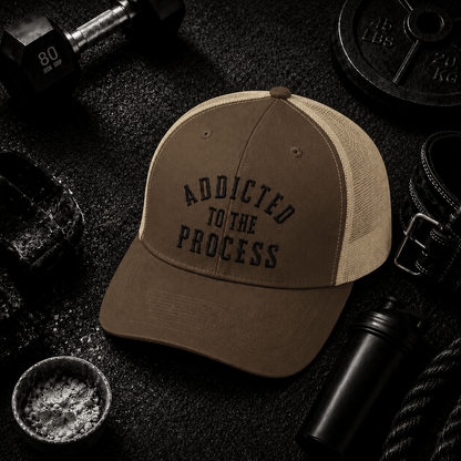 Addicted to the Process Blackout — Trucker Hat - Discipline Over Motivation 24/7
