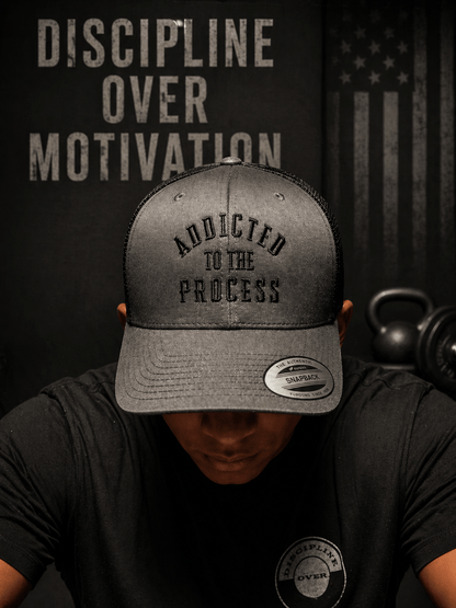 Addicted to the Process Blackout — Trucker Hat - Discipline Over Motivation 24/7