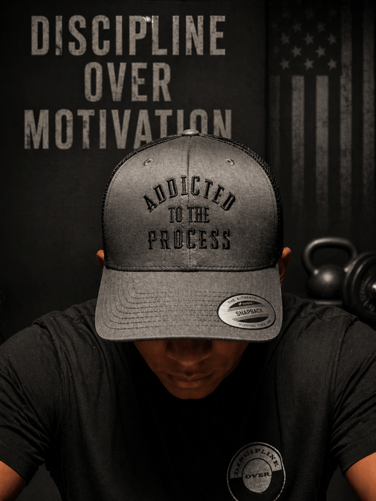 Addicted to the Process Blackout — Trucker Hat - Discipline Over Motivation 24/7