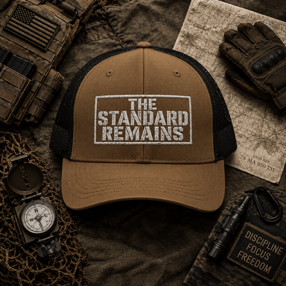 THE STANDARD REMAINS™ — EMBROIDERED TRUCKER HAT - Discipline Over Motivation 24/7
