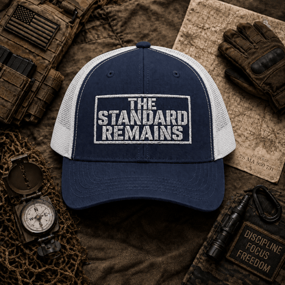 THE STANDARD REMAINS™ — EMBROIDERED TRUCKER HAT - Discipline Over Motivation 24/7
